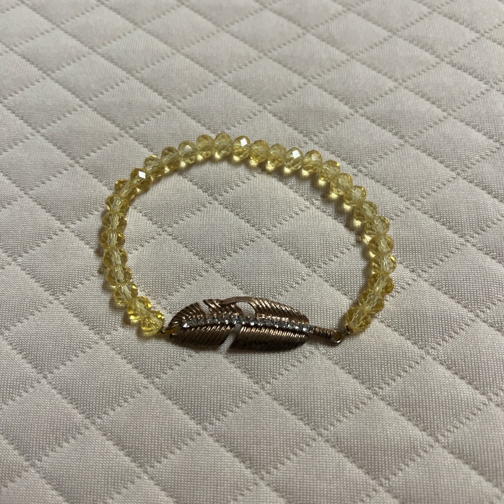 Yellow Beaded Bracelet with Gold Feather Accent